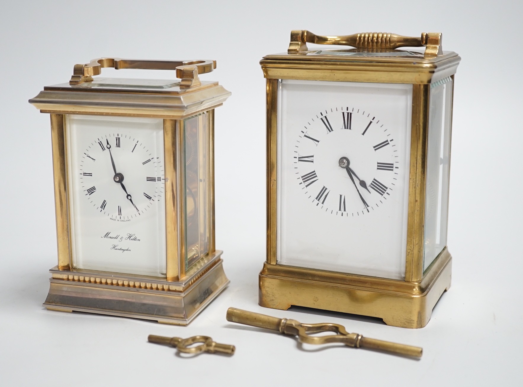Two English brass carriage clocks with winding keys. Tallest 14.5cm